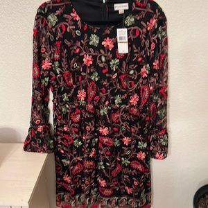 New with tags, beautiful detailed dress with fitted detailed waist band